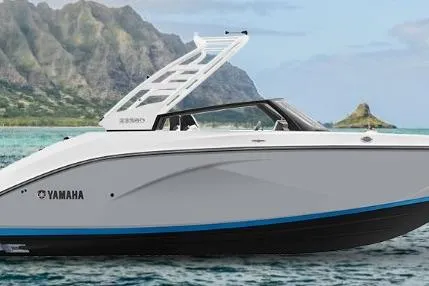 Slide: The Image of 2026 Yamaha Boats 222SD in scenic coastal waters with mountains in the background. - 48
