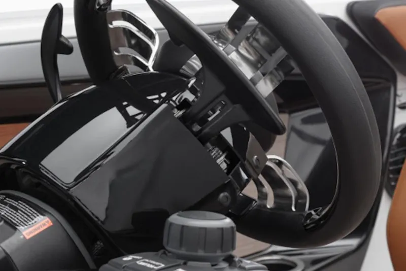 Slide: The Image of Steering wheel and controls of 2026 Yamaha Boats 222SD, showcasing sleek design. - 52