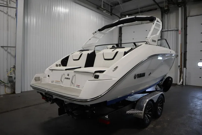 Slide: The Image of 2026 Yamaha Boats 222SD on trailer in indoor storage facility. - 56