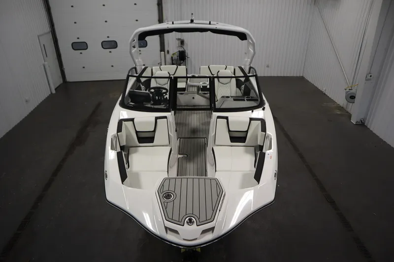 Slide: The Image of 2026 Yamaha Boats 222SD in a showroom, showcasing sleek design and spacious seating. - 8