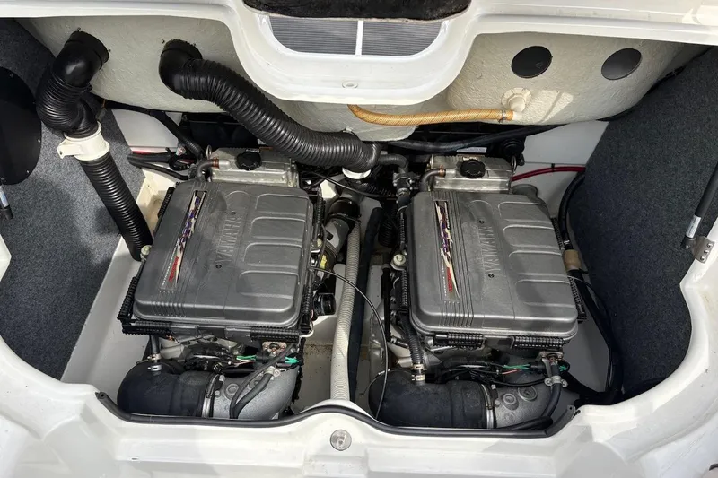 Slide: The Image of 2009 Yamaha Boats SX230 HO engine compartment with dual engines and components. - 10