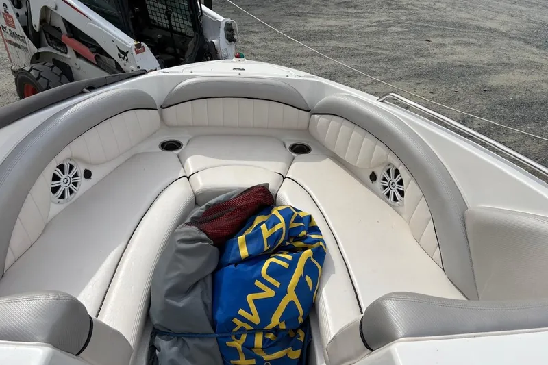 Slide: The Image of 2009 Yamaha Boats SX230 HO interior with white seating and colorful gear. - 8