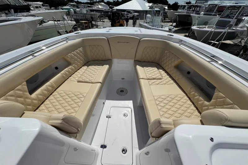 Slide: The Image of Luxurious seating on 2026 Southport 33 DC boat, featuring diamond-stitched upholstery. - 11