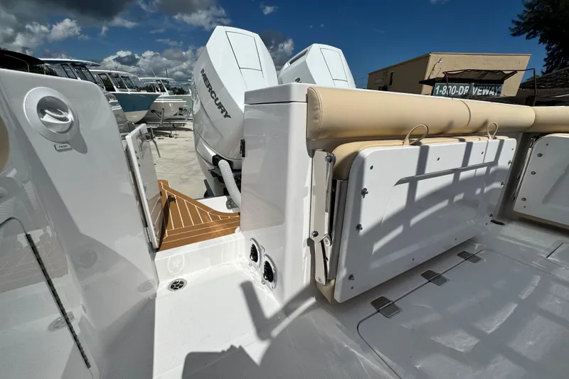 Slide: The Image of 2026 Southport 33 DC boat with Mercury engines, featuring a sleek deck and seating area. - 41