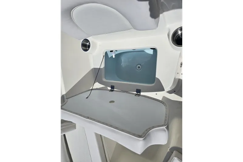 Slide: The Image of 2026 Sea Born LX21 Center Console interior storage compartment with open hatch. - 15
