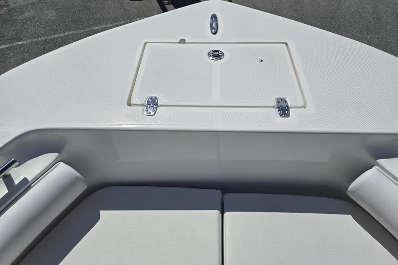 Slide: The Image of 2026 Sea Born LX21 Center Console boat deck with storage compartment. - 17