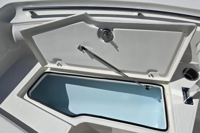 Slide: The Image of Open storage compartment on 2026 Sea Born LX21 Center Console boat. - 19