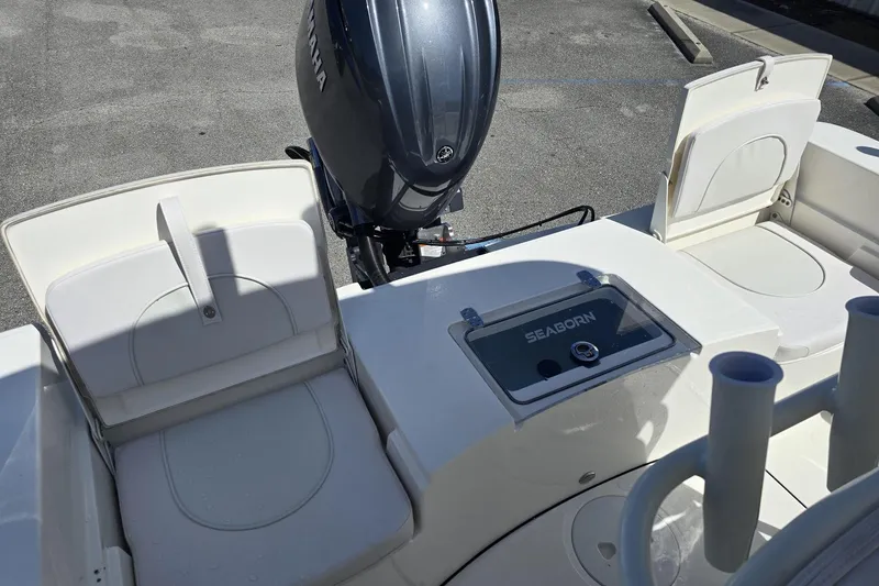 Slide: The Image of 2026 Sea Born LX21 Center Console boat interior with Yamaha engine, featuring seating and storage. - 3