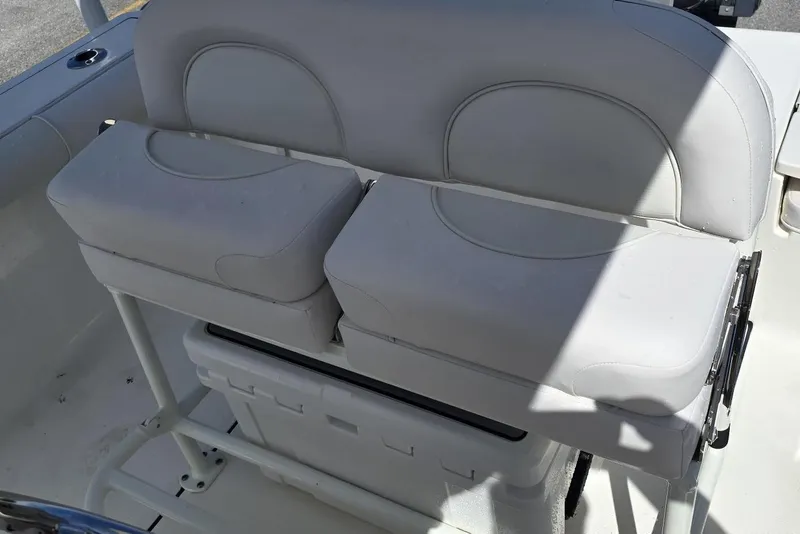 Slide: The Image of 2026 Sea Born LX21 Center Console boat seating with storage underneath. - 8