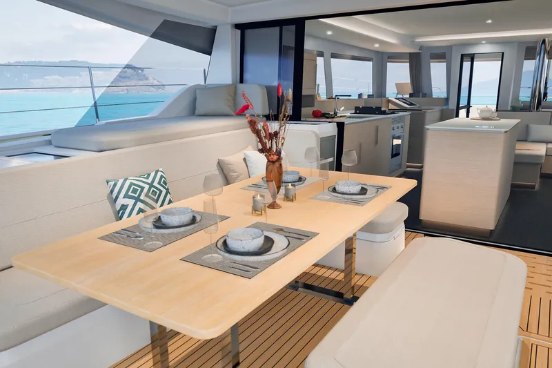 Slide: The Image of Luxurious interior of 2026 Fountaine Pajot 55 yacht with ocean view and elegant dining setup. - 41