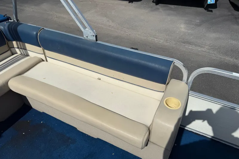 Slide: The Image of Crest 18 pontoon boat seat, beige and blue upholstery, 1997 model. - 13