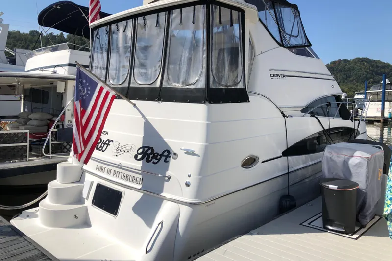 The Image of 2004 Carver 366 Motor Yacht docked, displaying American flag, Port of Pittsburgh. - 0