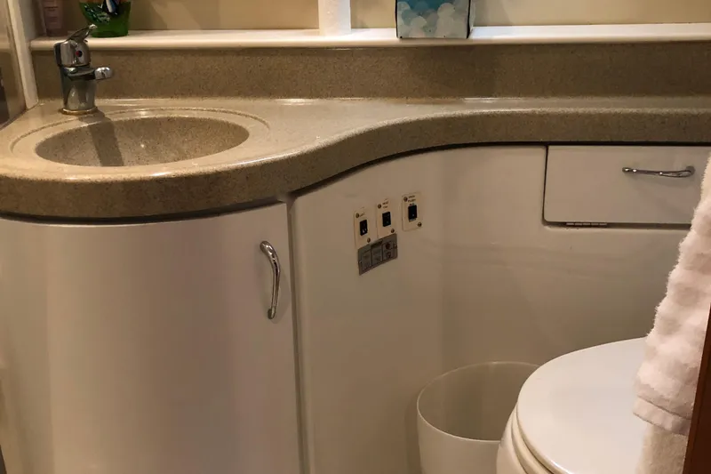 Slide: The Image of 2004 Carver 366 Motor Yacht bathroom with sink, faucet, and toilet. - 14