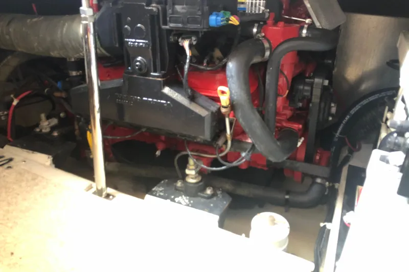 Slide: The Image of Engine compartment of a 2004 Carver 366 Motor Yacht, showcasing mechanical components. - 21