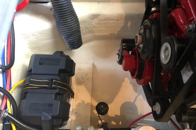 Slide: The Image of Engine compartment of a 2004 Carver 366 Motor Yacht, showing battery and mechanical components. - 22