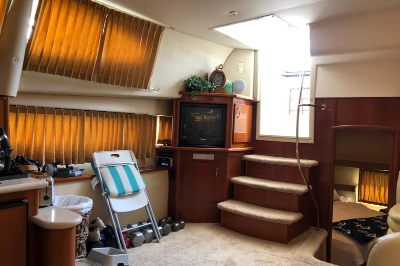 Slide: The Image of Interior of 2004 Carver 366 Motor Yacht with cozy seating and entertainment area. - 9