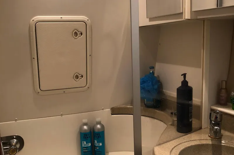 Slide: The Image of Bathroom interior of 2004 Carver 366 Motor Yacht with toiletries and storage. - 16