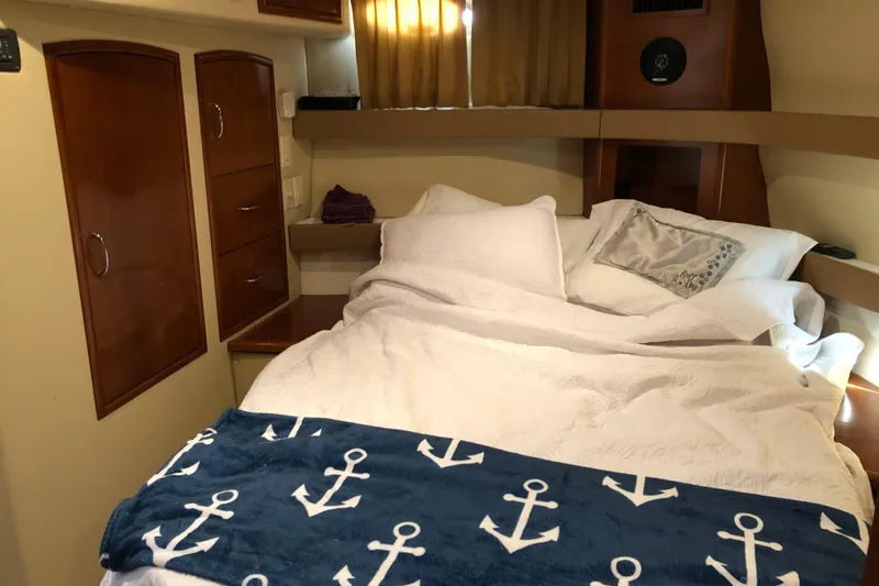 Slide: The Image of Cozy bedroom in 2004 Carver 366 Motor Yacht with nautical-themed bedding. - 17