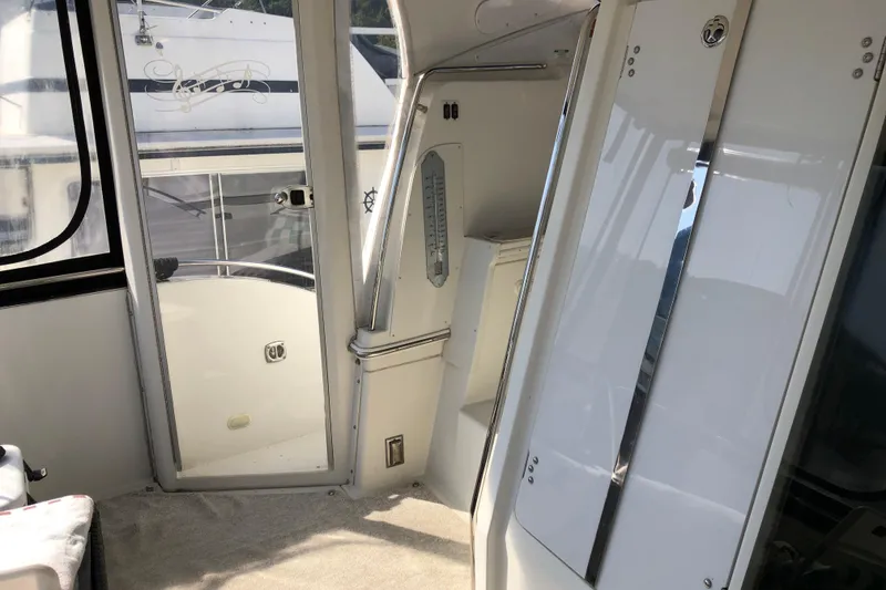 Slide: The Image of Interior view of 2004 Carver 366 Motor Yacht, featuring sleek white design elements. - 25