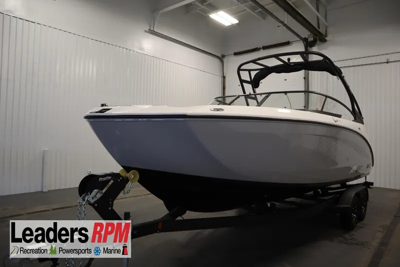 The Image of 2026 Yamaha Boats AR250 in showroom, sleek design, on trailer, Leaders RPM logo visible. - 0