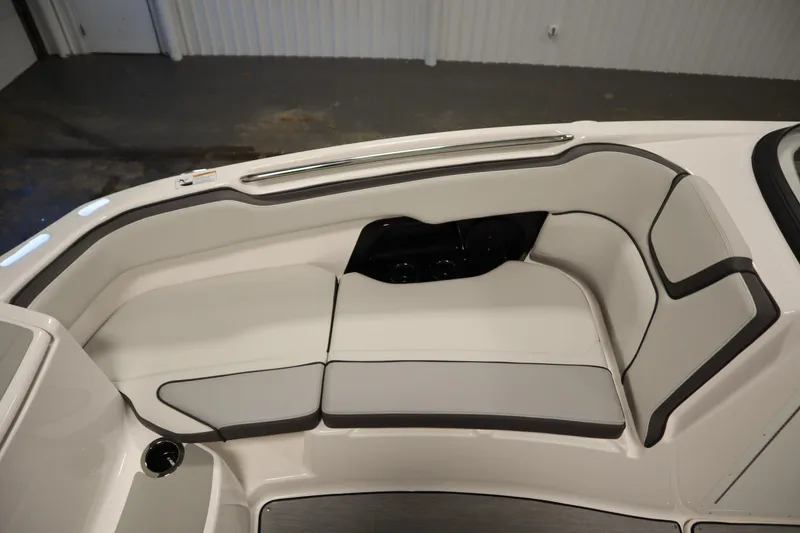 Slide: The Image of 2026 Yamaha Boats AR250 interior seating with sleek, modern design and comfortable cushions. - 14