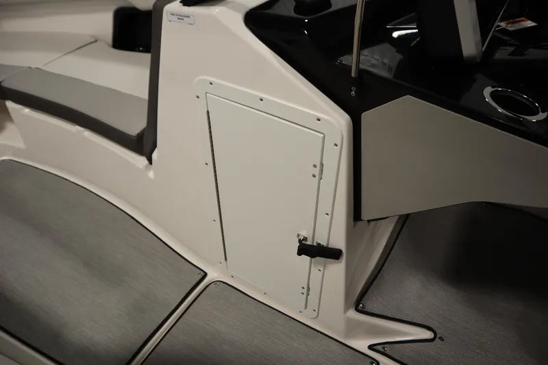 Slide: The Image of 2026 Yamaha Boats AR250 interior with storage compartment and seating. - 18