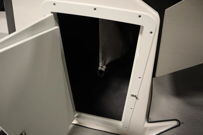 Slide: The Image of Open storage compartment on 2026 Yamaha Boats AR250. - 19