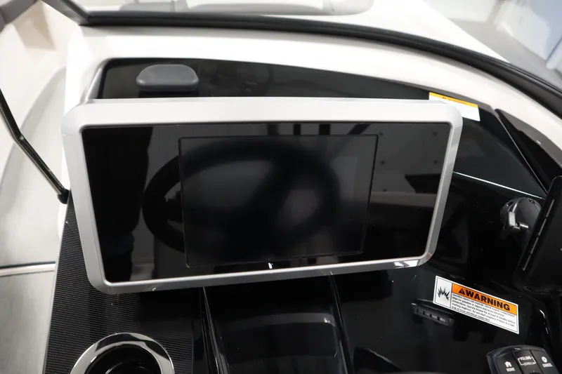 Slide: The Image of 2026 Yamaha Boats AR250 dashboard with touchscreen display and warning label. - 23