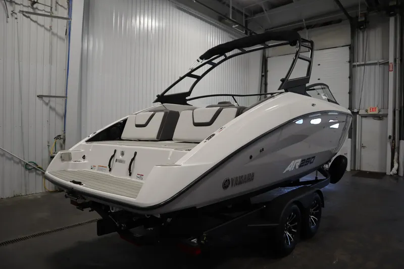 Slide: The Image of 2026 Yamaha Boats AR250 in a garage, showcasing sleek design and modern features. - 4