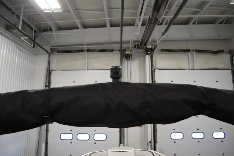 Slide: The Image of 2026 Yamaha Boats AR250 in a garage, featuring a covered component. - 40