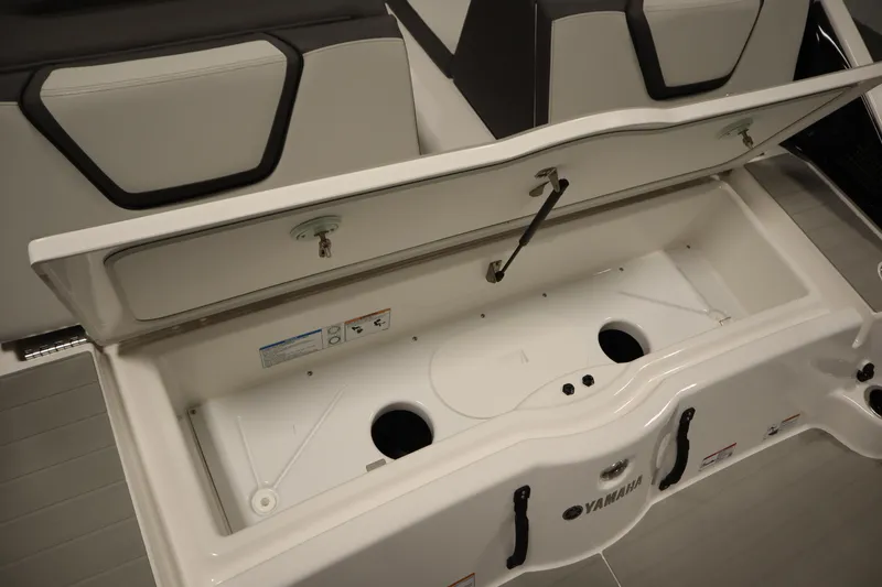 Slide: The Image of Open storage compartment in 2026 Yamaha Boats AR250, showcasing spacious interior design. - 42