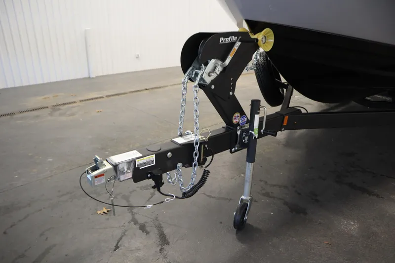 Slide: The Image of 2026 Yamaha Boats AR250 trailer hitch and support wheel in a garage setting. - 45