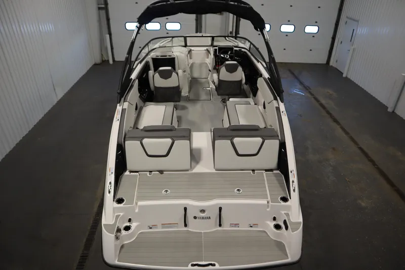 Slide: The Image of 2026 Yamaha Boats AR250 interior view in a garage setting. - 9