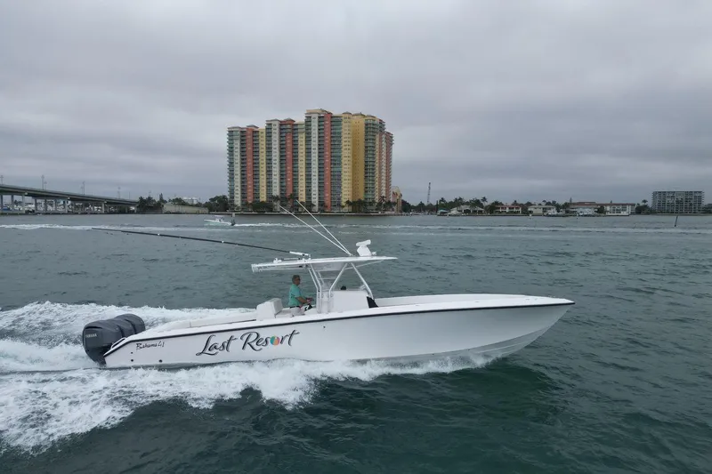 The Image of 2013 Bahama 41 Open Fisherman cruising near colorful waterfront buildings. - 0