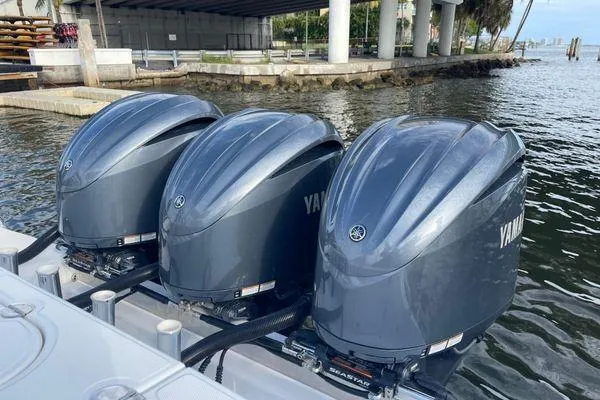 Slide: The Image of Triple Yamaha outboard engines on a 2013 Bahama 41 Open Fisherman boat. - 21
