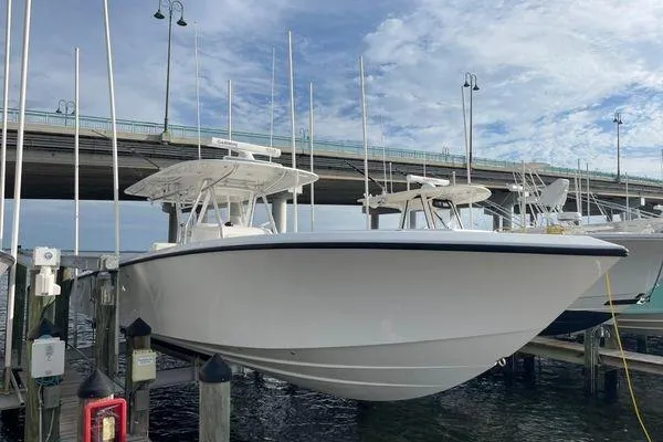 Slide: The Image of 2013 Bahama 41 Open Fisherman boat docked under a bridge on a sunny day. - 22