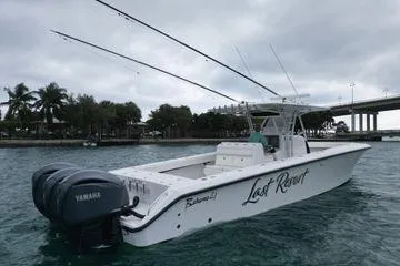Slide: The Image of 2013 Bahama 41 Open Fisherman boat with Yamaha engines on a cloudy day. - 26