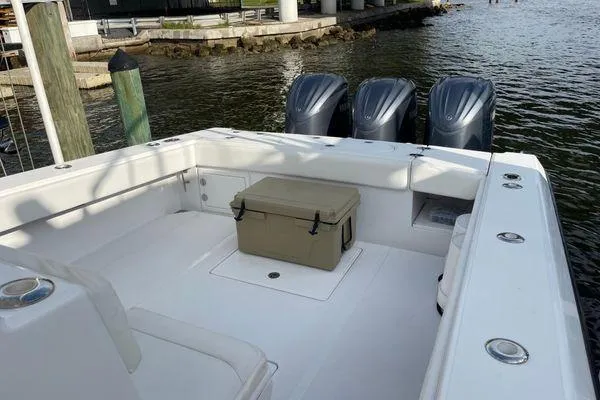 Slide: The Image of 2013 Bahama 41 Open Fisherman boat with triple outboard engines and spacious deck. - 4