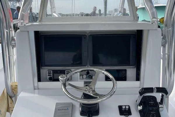 Slide: The Image of 2013 Bahama 41 Open Fisherman helm with dual screens and steering wheel. - 5