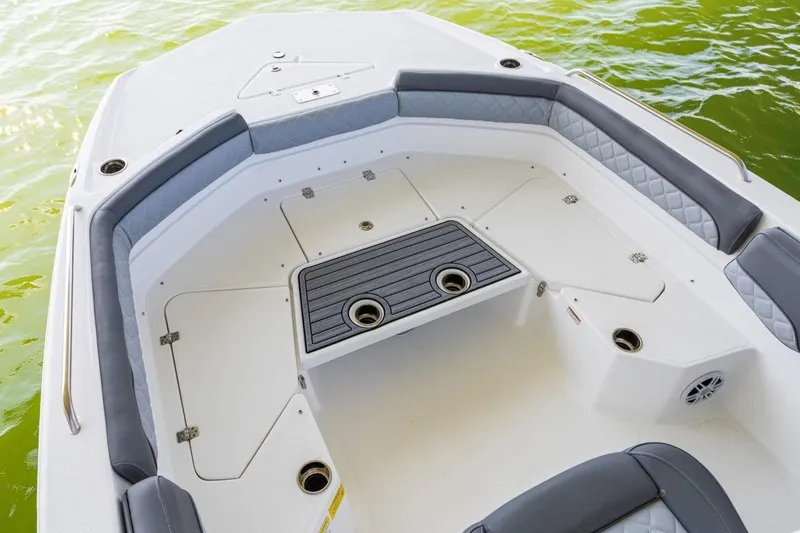 Slide: The Image of 2026 NauticStar 231 Hybrid boat interior with cushioned seating and storage compartments. - 3