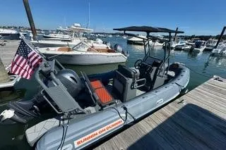 Slide: The Image of 2025 Highfield Sport 560 boat with Yamaha engine on a calm lake. - 2
