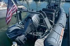 Slide: The Image of Highfield Sport 560 boat (2025) with Yamaha engine on calm water, American flag displayed. - 4