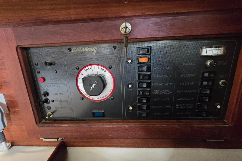 Slide: The Image of Control panel of a 1989 Catalina 36 sailboat with switches and dials. - 16