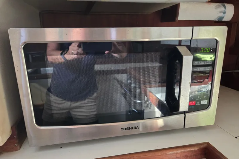 Slide: The Image of Toshiba microwave in a 1989 Catalina 36 yacht kitchen setting. - 20