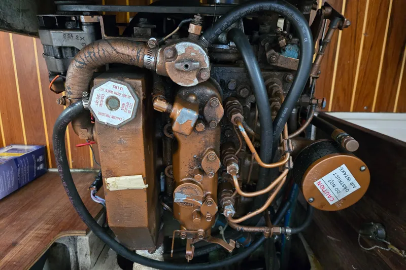 Slide: The Image of Engine of a 1989 Catalina 36 sailboat, showcasing intricate mechanical components. - 30