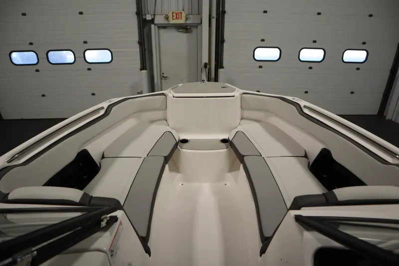 Slide: The Image of 2026 Yamaha Boats AR250 interior with spacious seating and modern design. - 10