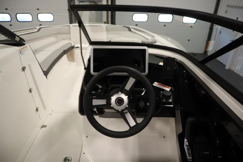 Slide: The Image of 2026 Yamaha Boats AR250 cockpit with steering wheel and modern dashboard controls. - 17