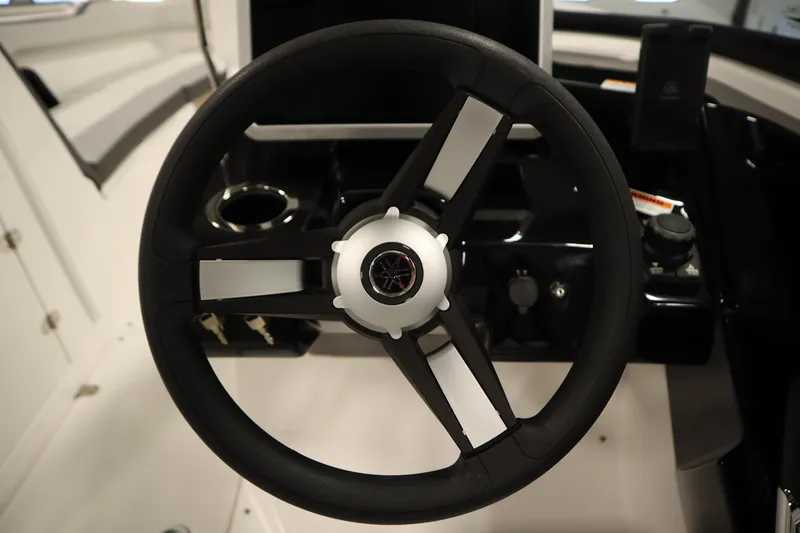 Slide: The Image of Steering wheel of 2026 Yamaha Boats AR250, featuring sleek black and white design. - 18