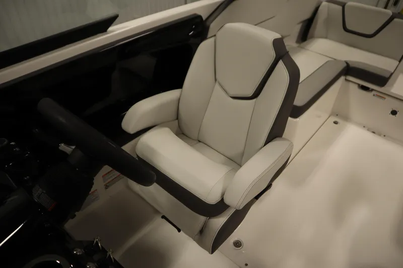 Slide: The Image of 2026 Yamaha Boats AR250 interior with sleek, modern seating and steering wheel. - 24