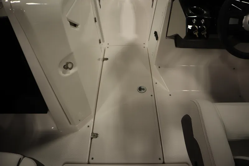 Slide: The Image of 2026 Yamaha Boats AR250 interior, featuring sleek white flooring and modern design elements. - 27
